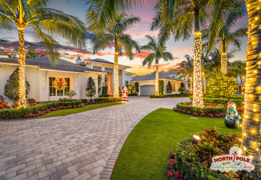 Luxury residential holiday lighting at The Bears Club in Jupiter featuring warm white LED palm tree wraps and lit wreaths.