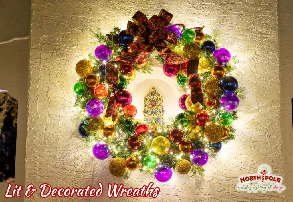 Large custom-decorated holiday wreaths with multi-colored ornaments and warm white LEDs in Jupiter.