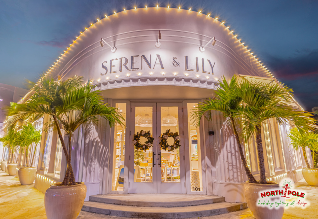 Luxury retail holiday lighting at Serena and Lily on Worth Avenue, Palm Beach, featuring warm white LED roofline outlining and lit planter palms.