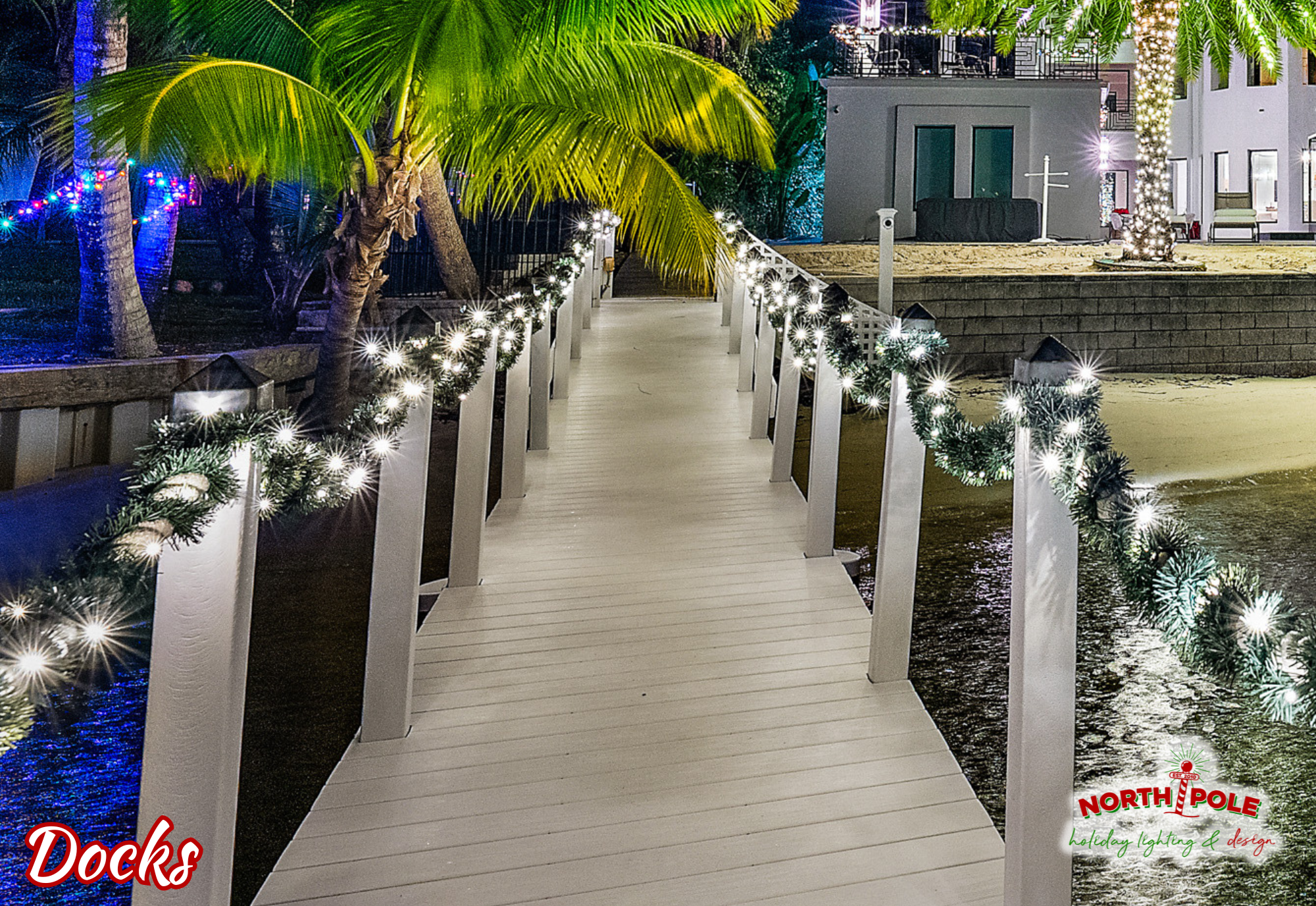 Luxury Jupiter Island waterfront estate featuring marine-grade LED garland and string lighting on a private boat dock and walkway at sunset.