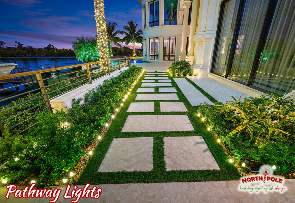 Modern LED ground pathway lighting following a manicured driveway at a Palm Beach Gardens estate.