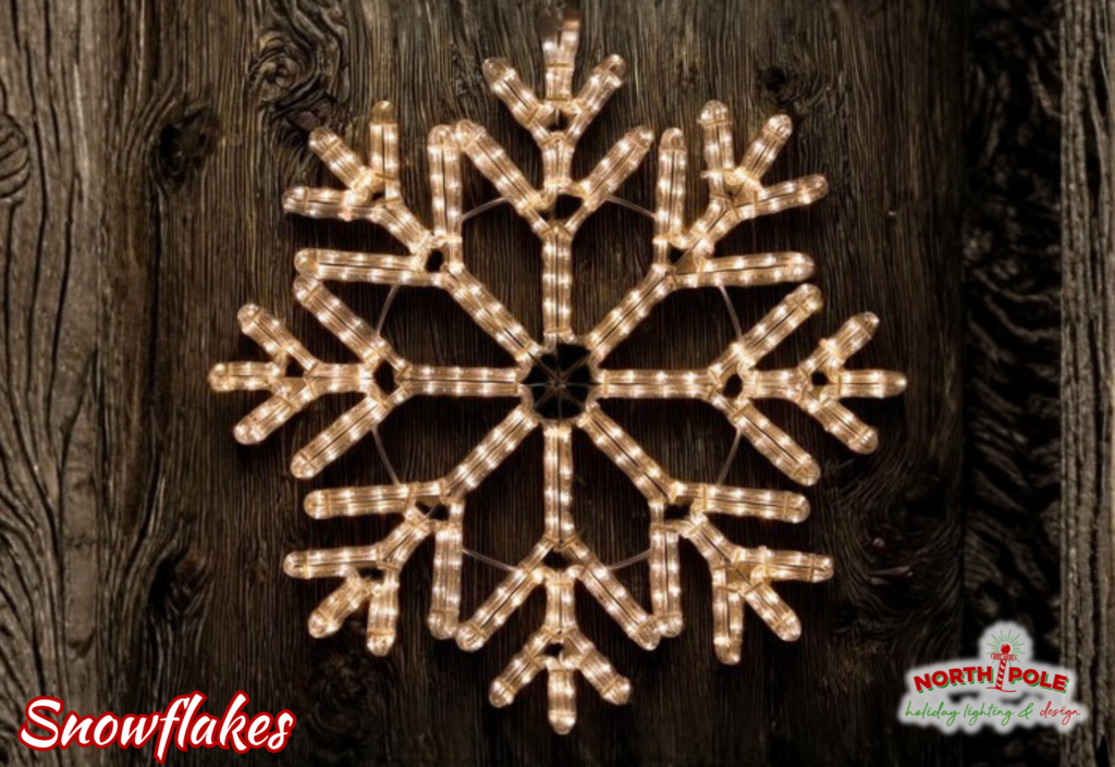 Large outdoor LED snowflake light fixtures mounted on a residential exterior in Port St. Lucie.