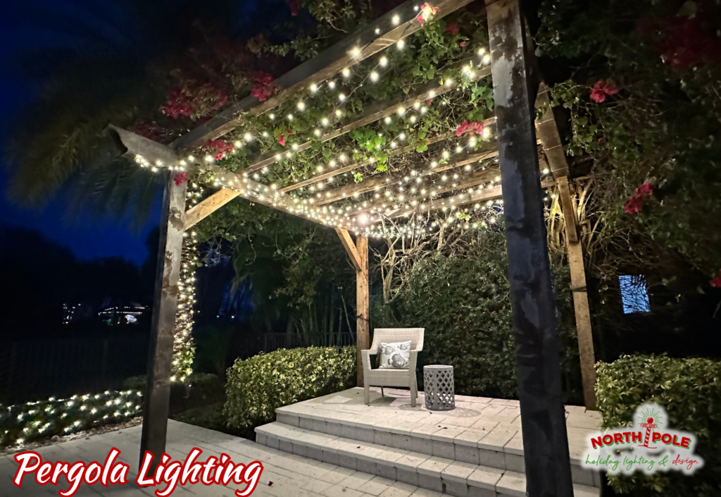Intimate Boca Raton backyard patio featuring a rustic pergola canopy with integrated starry night fairy lighting and a cozy seating area.