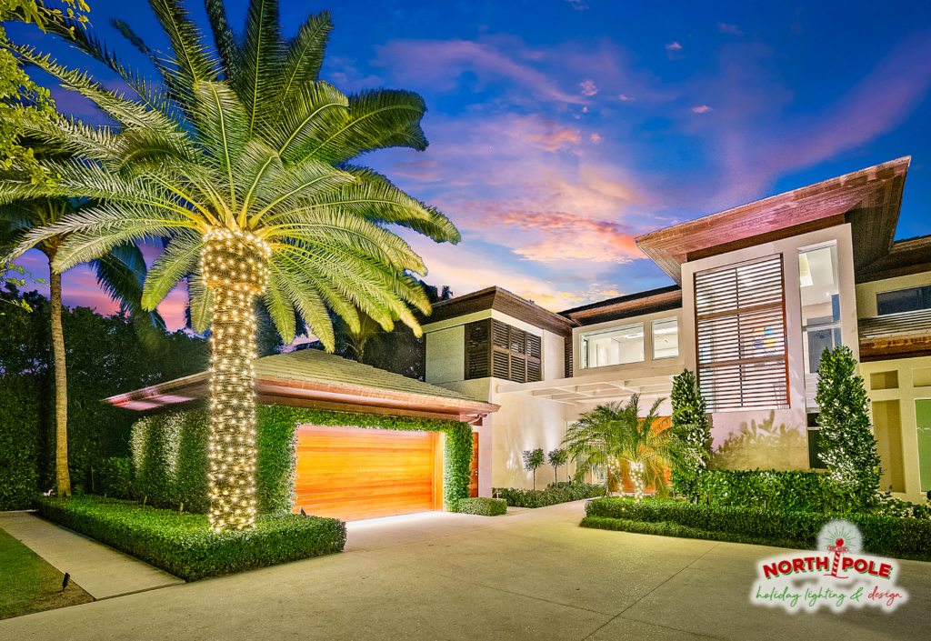 Modern West Palm Beach estate holiday lighting featuring high-density warm white LED palm trunk wraps and architectural accent lighting.