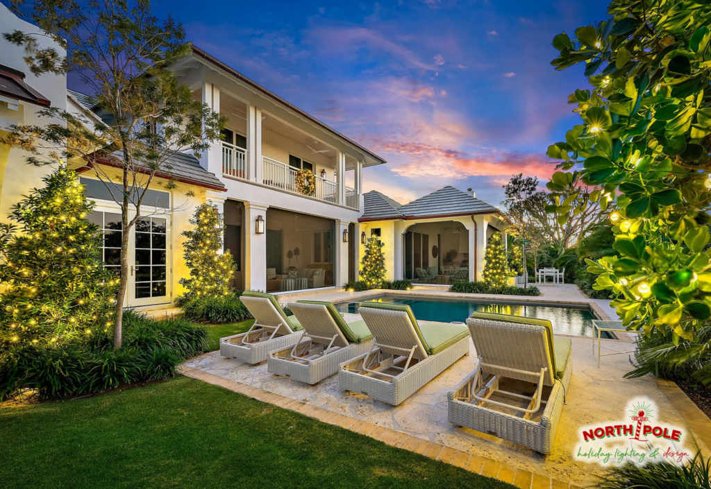 Luxury pool-side holiday lighting at Old Marsh Golf Club featuring illuminated manicured trees and warm white LED architectural accents.